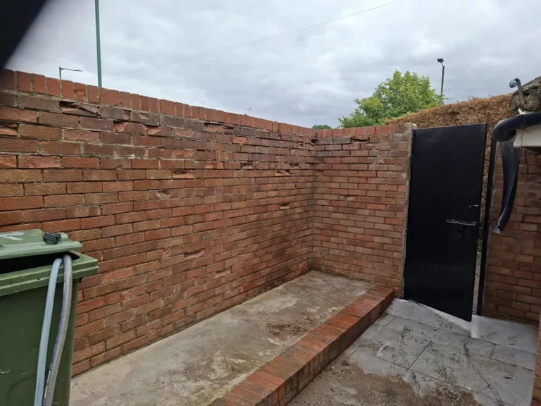 Courtyard brick wall pressure washed